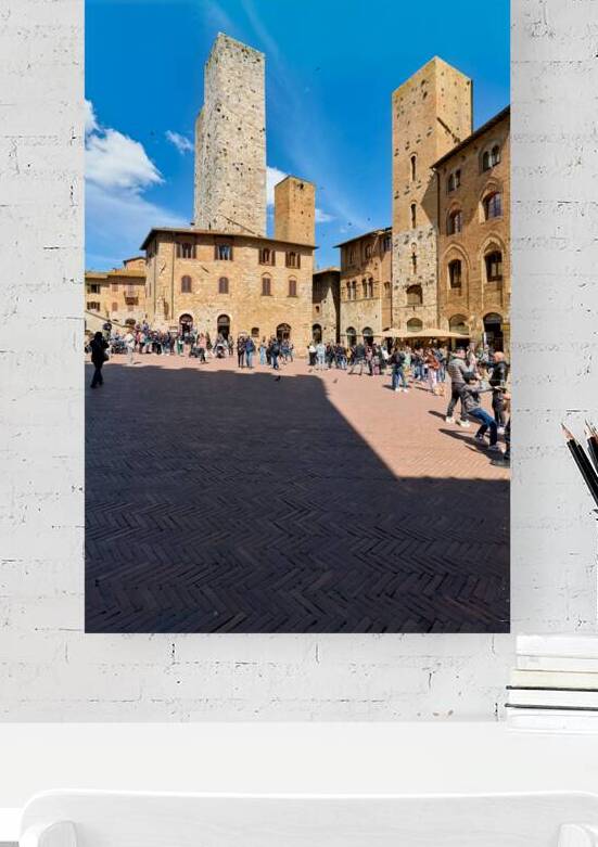 Visitors explore San Gimignano in Tuscany during the day by Marco Brivio