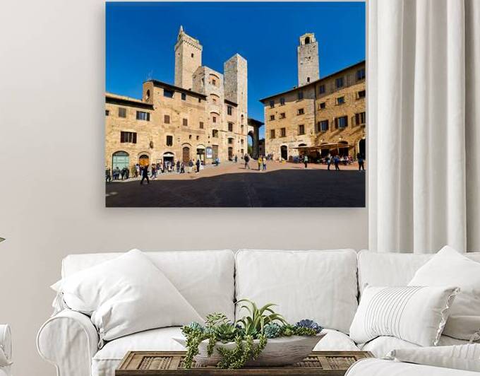 Visitors explore Piazza della Cisterna in San Gimignano by Marco Brivio