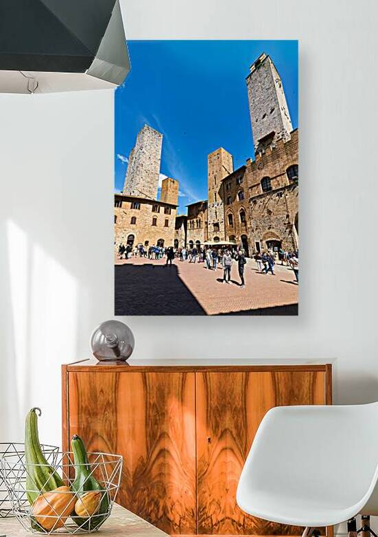 Visitors gather in Piazza del Duomo in San Gimignano Italy by Marco Brivio