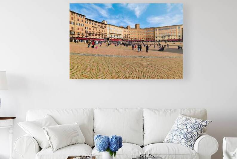 People gather in Piazza del Campo in Siena Tuscany Italy by Marco Brivio