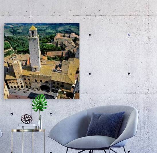 View of San Gimignano in Tuscany from above during the day by Marco Brivio