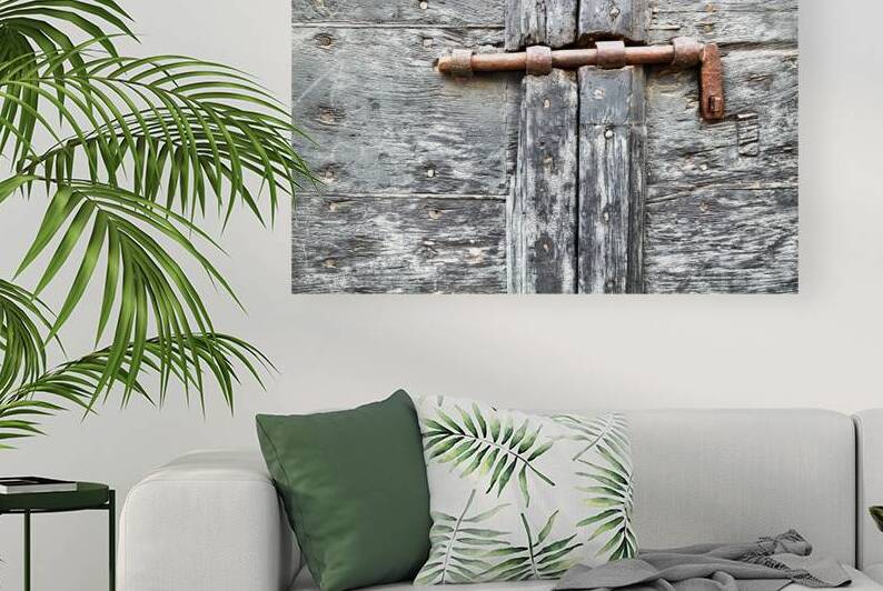 Wooden door with rusty latch in Pienza Val dOrcia Tuscany by Marco Brivio