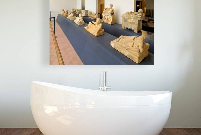 Cinerary urns in the Guarnacci Museum of Etruscan artifacts by Marco Brivio