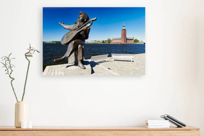 Evert Taube statue and City Hall by the water in Stockholm by Marco Brivio