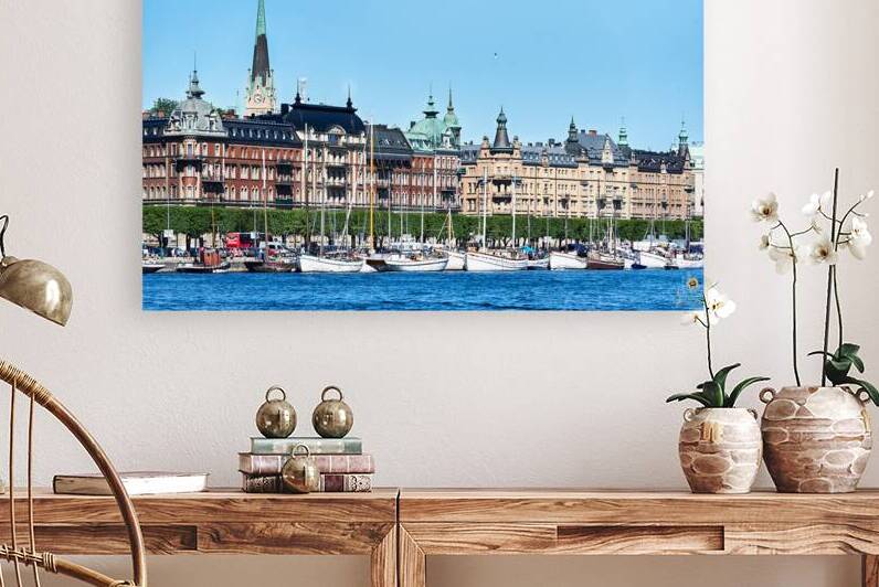 View of downtown Stockholm from the sea with boats and buildings by Marco Brivio