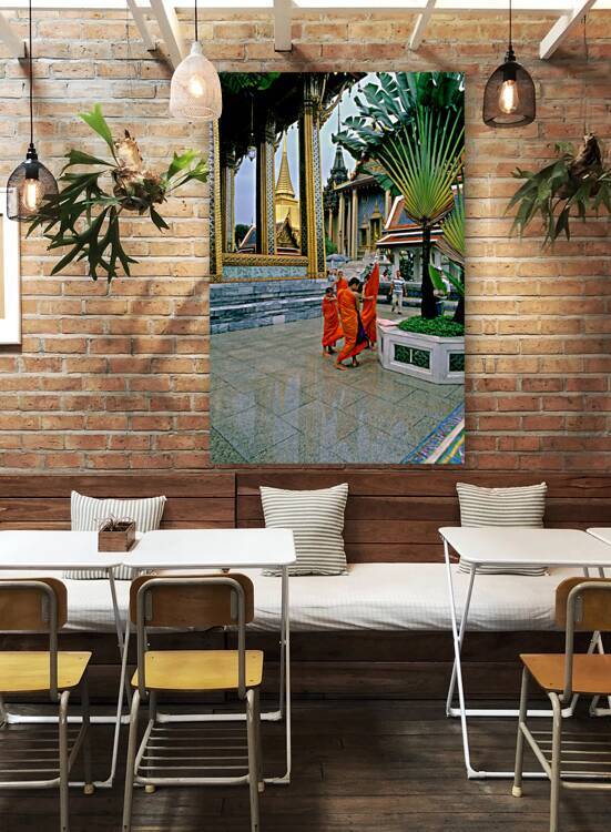 Monks walk in Wat Phra Kaew in Bangkok near the Grand Palace by Marco Brivio