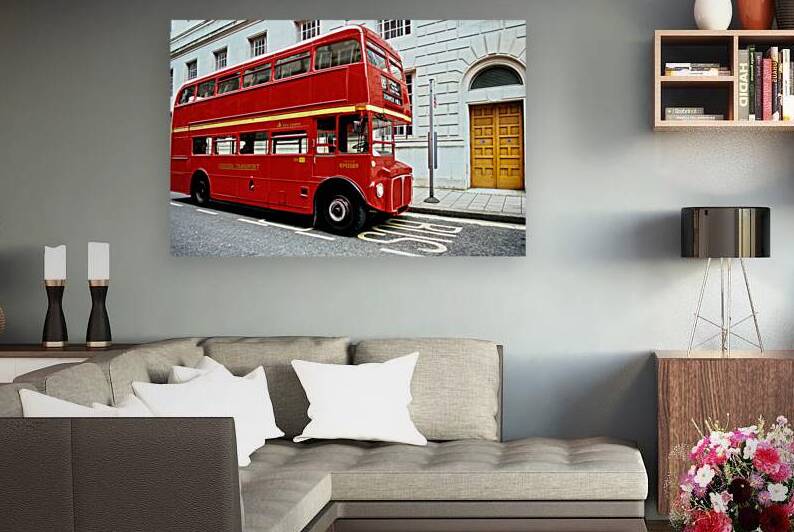 Red double decker bus stops near Tower Hill in London by Marco Brivio