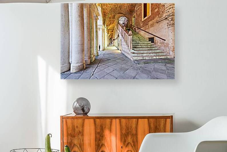 Visitors walk through the arches in Piazza dei Signori Vicenza by Marco Brivio