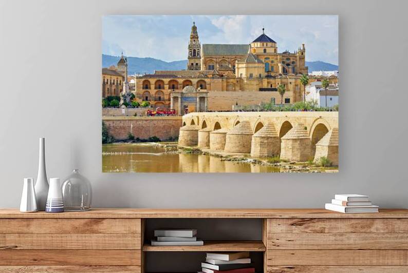 Cityscape of Cordoba with historic bridge and buildings by Marco Brivio