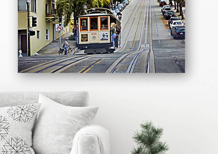 Cablecar travels on steep street in San Francisco by Marco Brivio