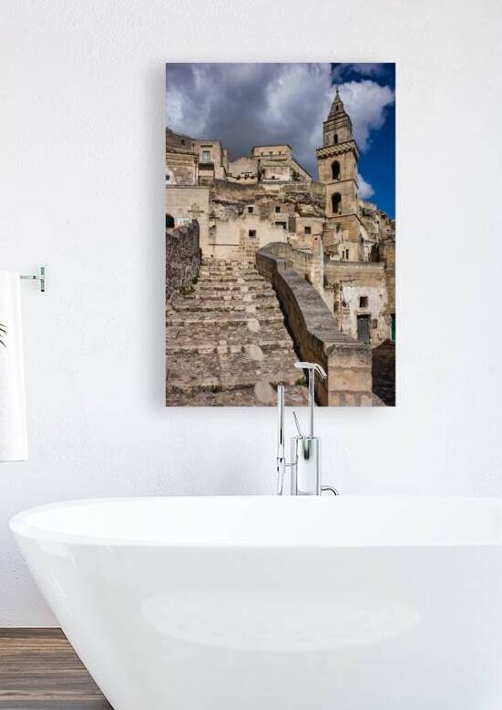 Visitors walk up the stone steps in Matera Italy by Marco Brivio