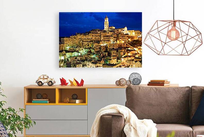 Matera cityscape at night with illuminated buildings by Marco Brivio