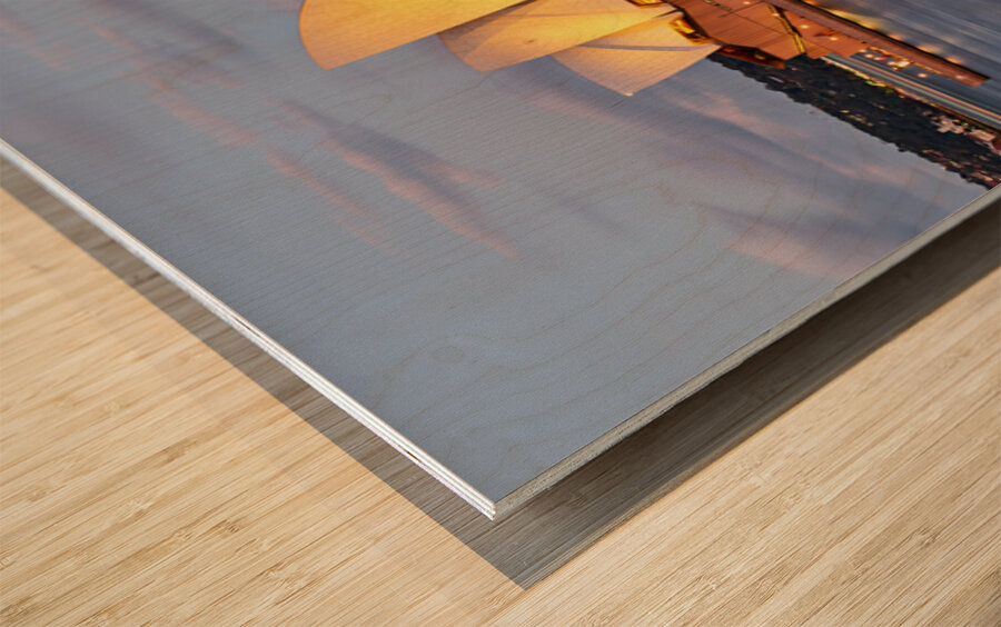 Sydney Opera House illuminated at dusk with harbor reflections. Wood print