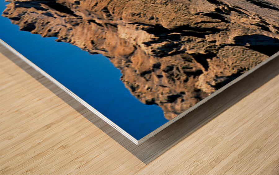 Arid mountain landscape with vans on a desert road. Wood print